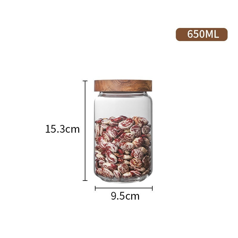 Contenedores de almacenamiento de vidrio con tapas de madera.