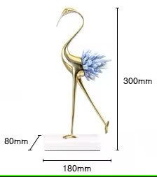 Escultura de grulla dorada con incrustaciones de cristales